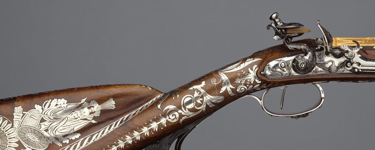 vintage sporting gun with inlaid silver