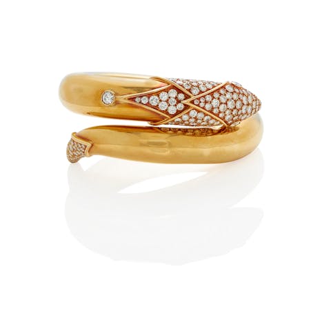 Christian Dior, 18K Gold and Dimanods Snake Hinged Bangle, sold in Bonhams Los Angeles in 2021 for US$24,062.50
