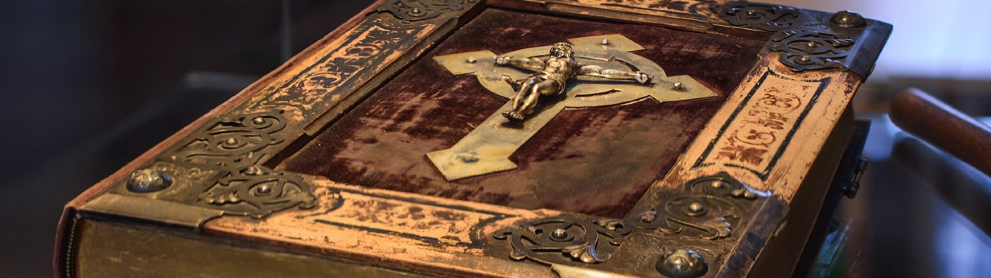 antique bible cover with crucifix