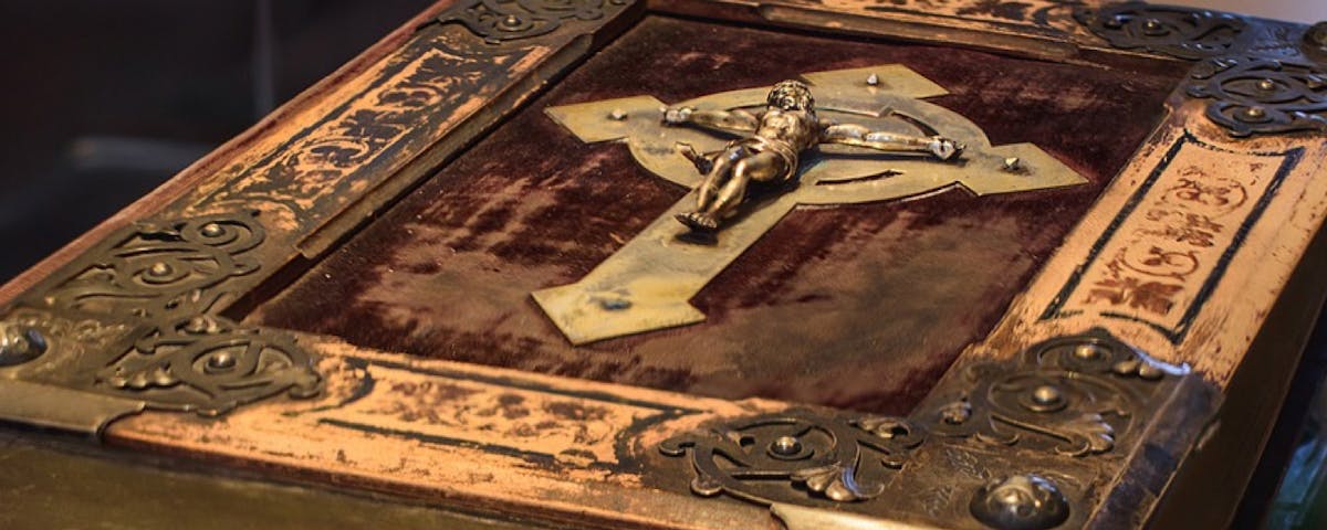 antique bible cover with crucifix