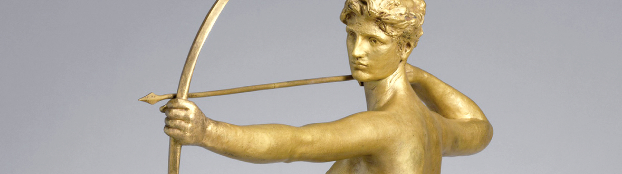 golden sculpture of archer