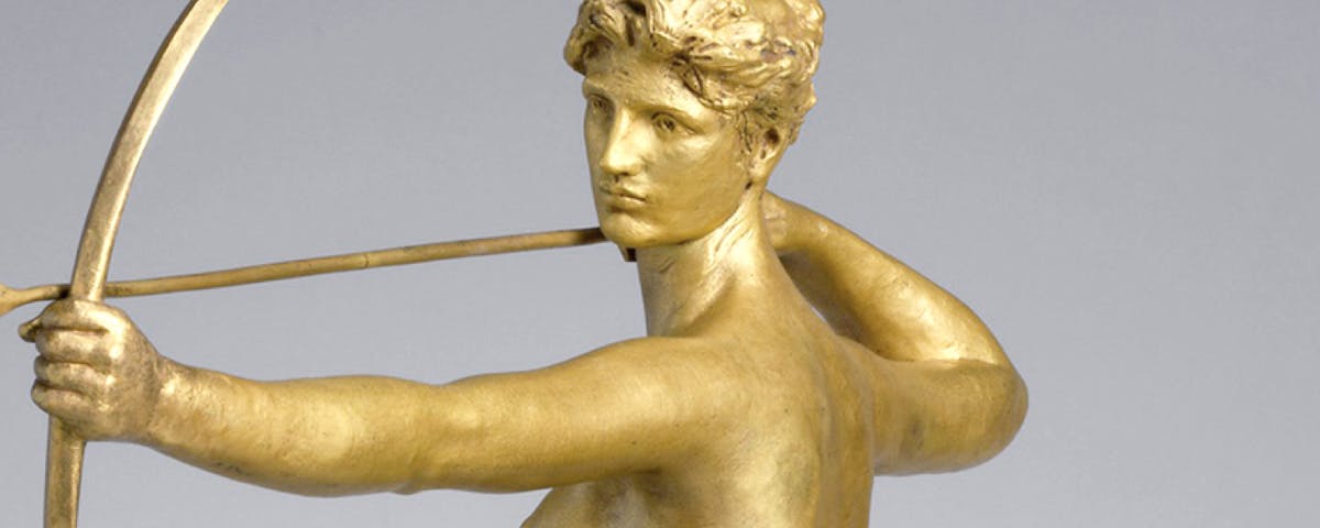 golden sculpture of archer