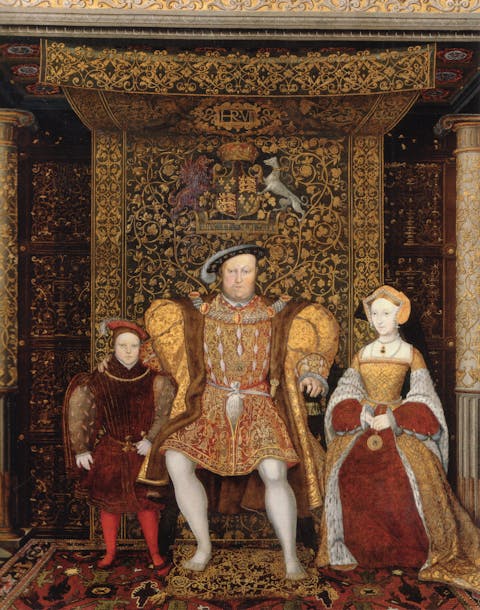 An oil painting from c. 1545 featuring King Henry VII seated beneath a tapestry cloth of state. (Public Domain)