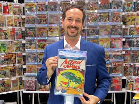 At the 2014 New York Comic Con, Vincent Zurzolo of Metropolis Collectibles displays the CGC 9.0 copy of Action Comics #1 for which his firm paid $3.2 million (USD).