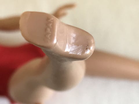 markings of a vintage Barbie doll's foot