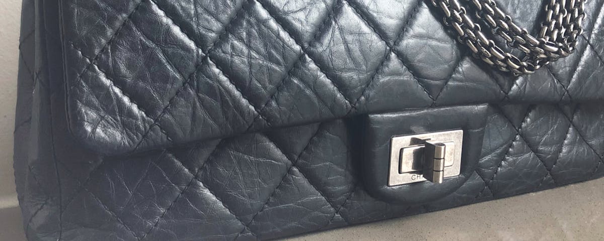 jumbo black Chanel 2.55 reissue handbag