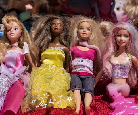 Modern Barbie dolls.
