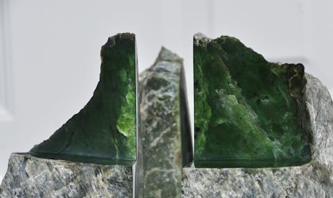 A piece of dark green raw jadeite jade.