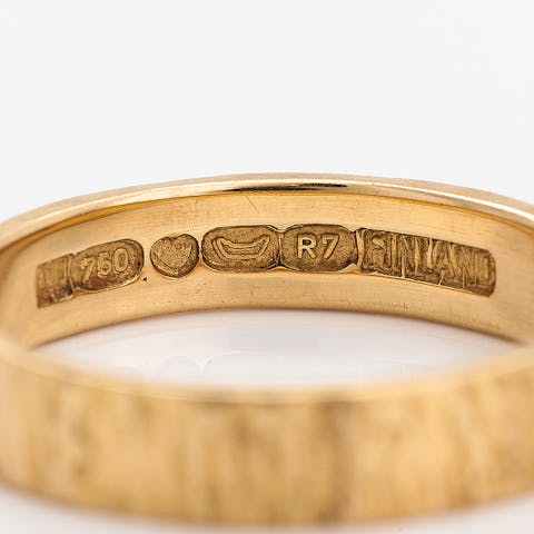 Purity markings and other stamps on a gold ring
