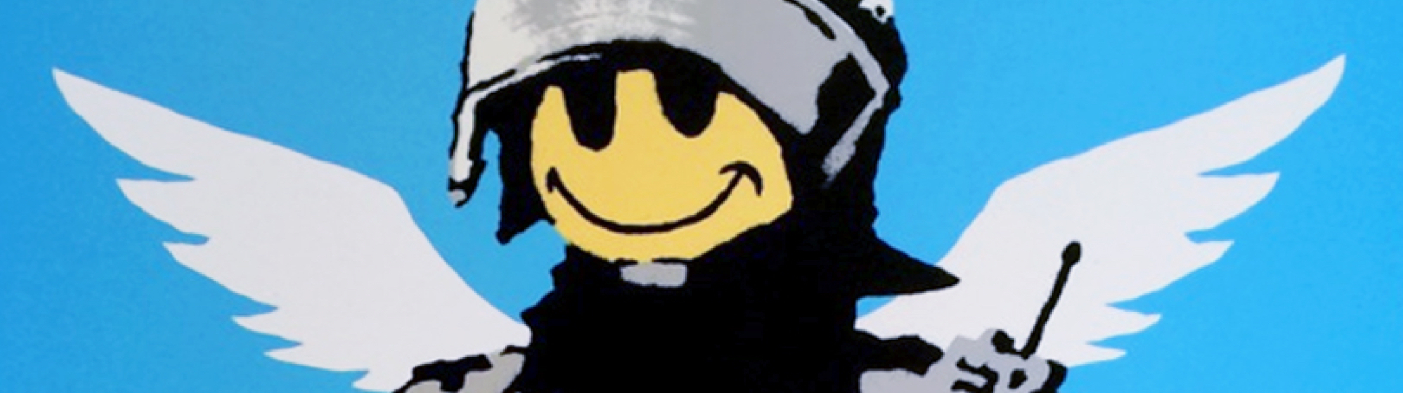 A Banksy print of armed policeman with smiley face and angel wings.