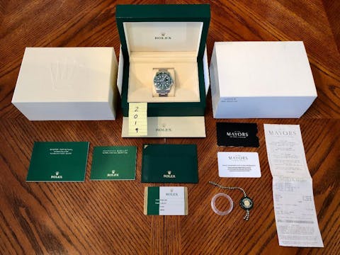 Rolex watch with original boxes and certifications