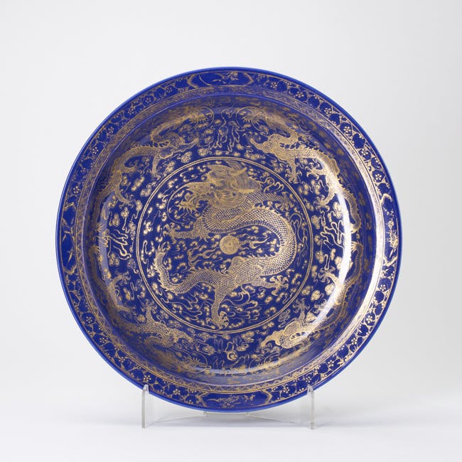 blue glazed porcelain dish with gold dragon