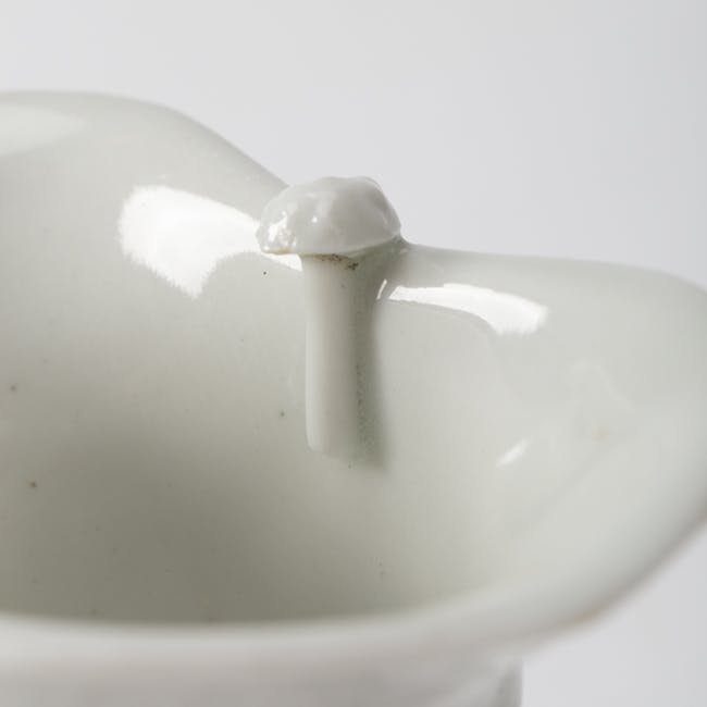 chinese blanc de chine porcelain libation cup jue shape, dehua capped posts detail