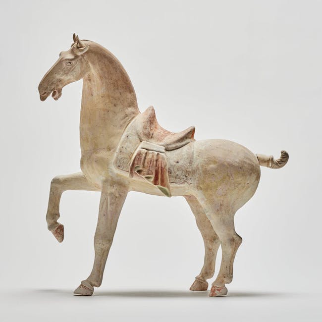Chinese pottery prancing horse from the Tang dynasty left side