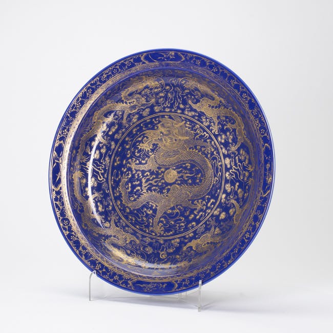 blue glazed porcelain dish with gold dragon side