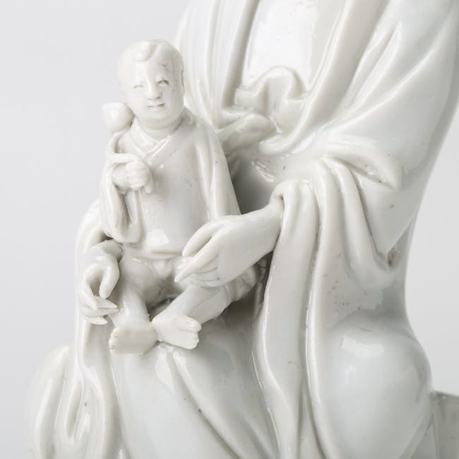 chinese blanc de chine porcelain guanyin with child