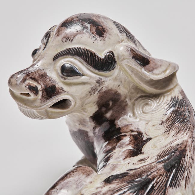 Chinese enamel on biscuit porcelain mythical dogs head detail