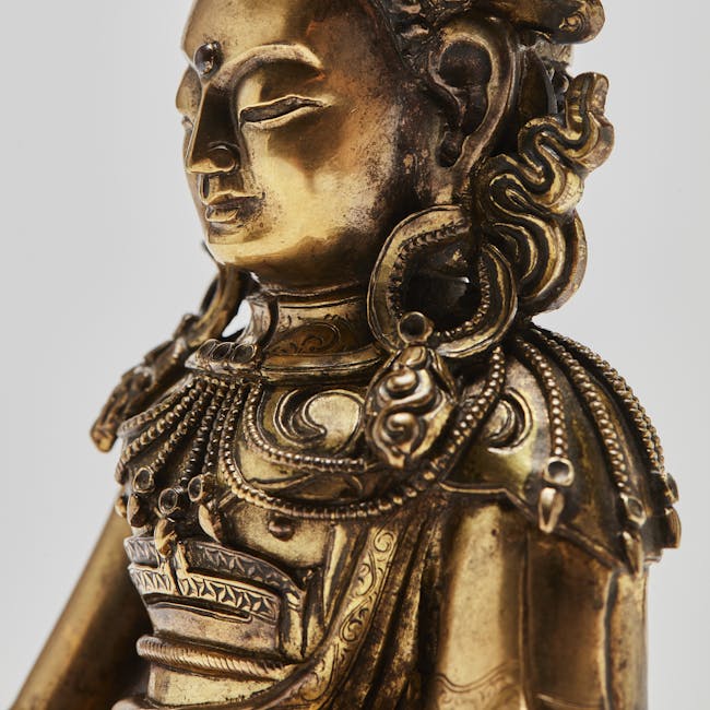 Sino-Tibetan gilt-bronze figure of Buddha Akshobhya