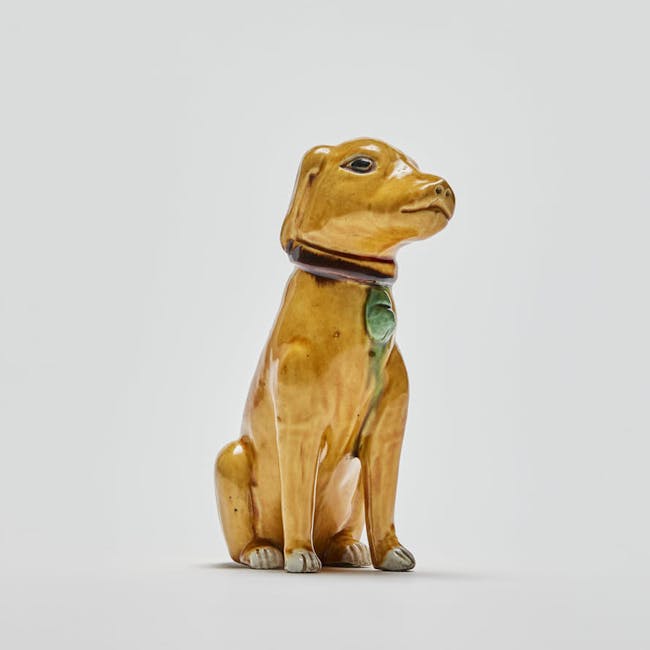 Chinese Enamel on Biscuit Porcelain Seated Dog facing right