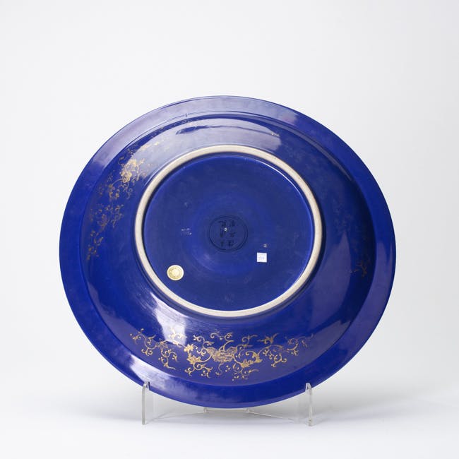 blue glazed porcelain dish with gold dragon underside
