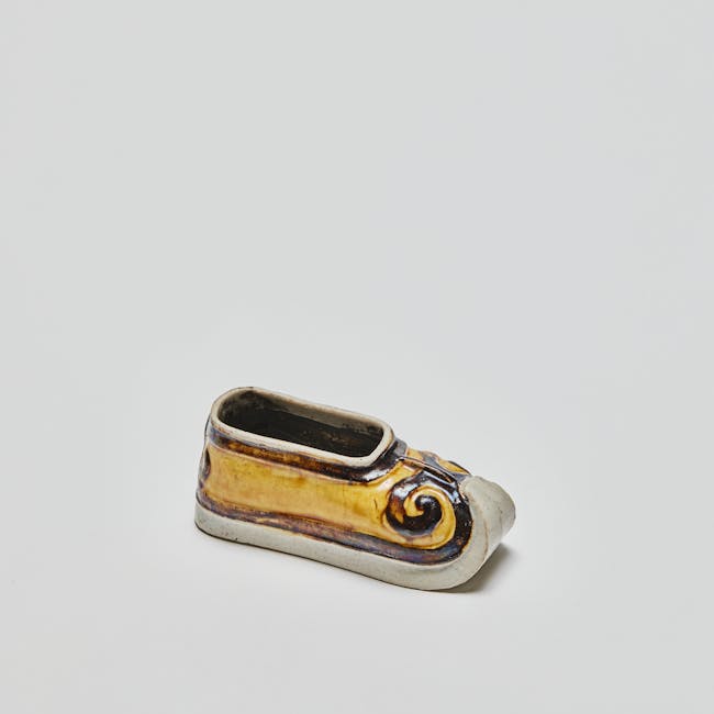 chinese enamel on biscuit model of yellow shoe