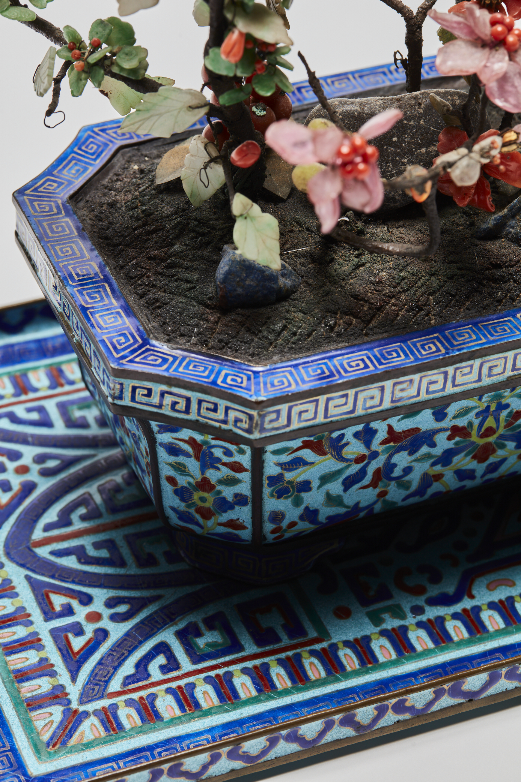 A Hardstone Embellished Miniature tree in a cloisonné enamel Jardiniere on a tray