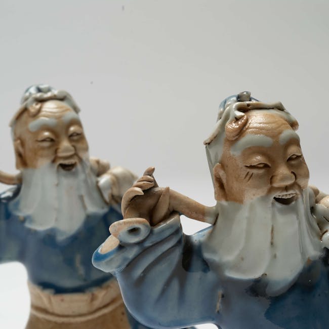 Chinese Coloured Porcelain Set of Two Figures detail heads