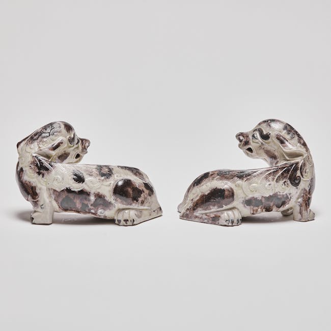Chinese enamel on biscuit porcelain mythical dogs side pair