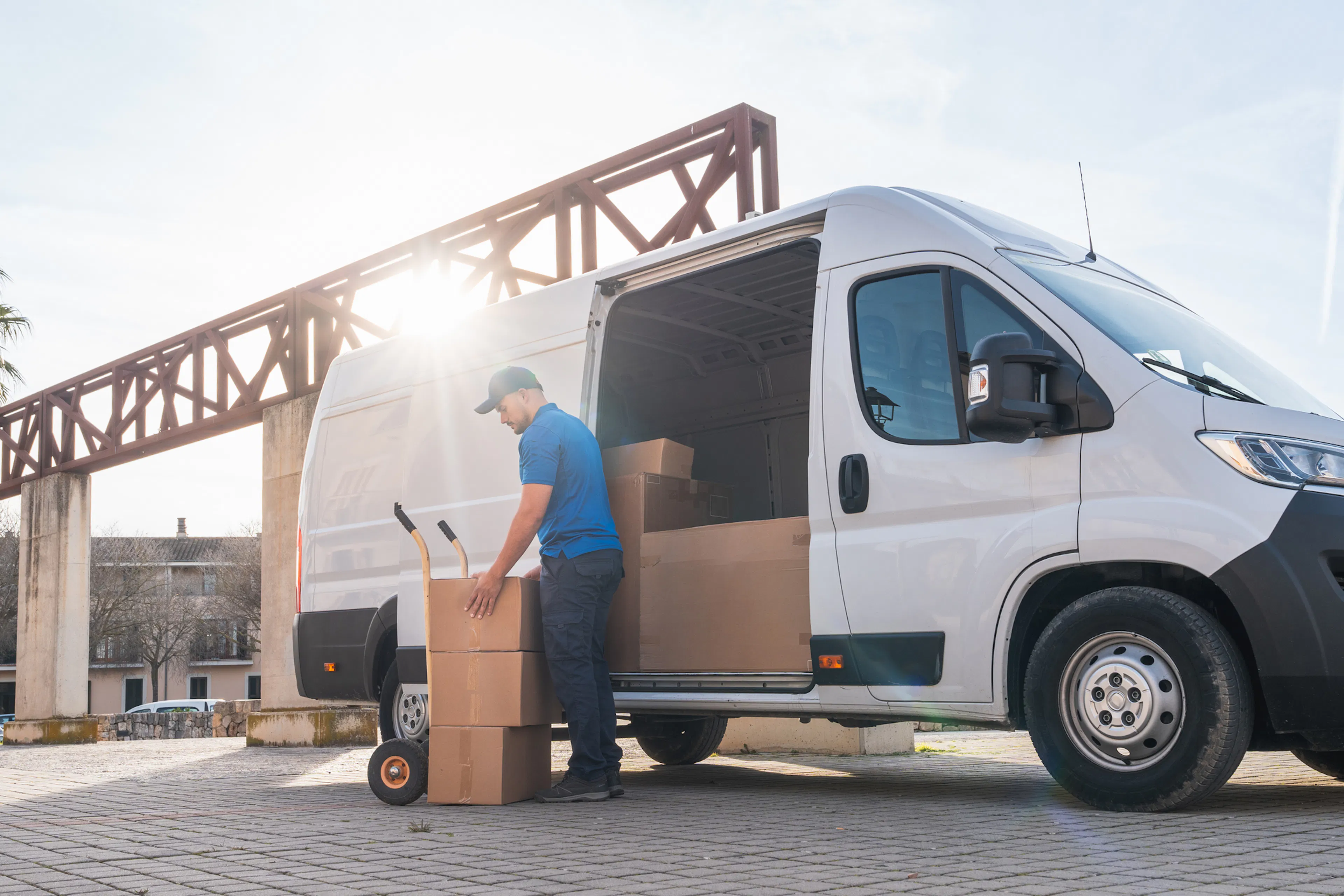 man unloading packages from a van