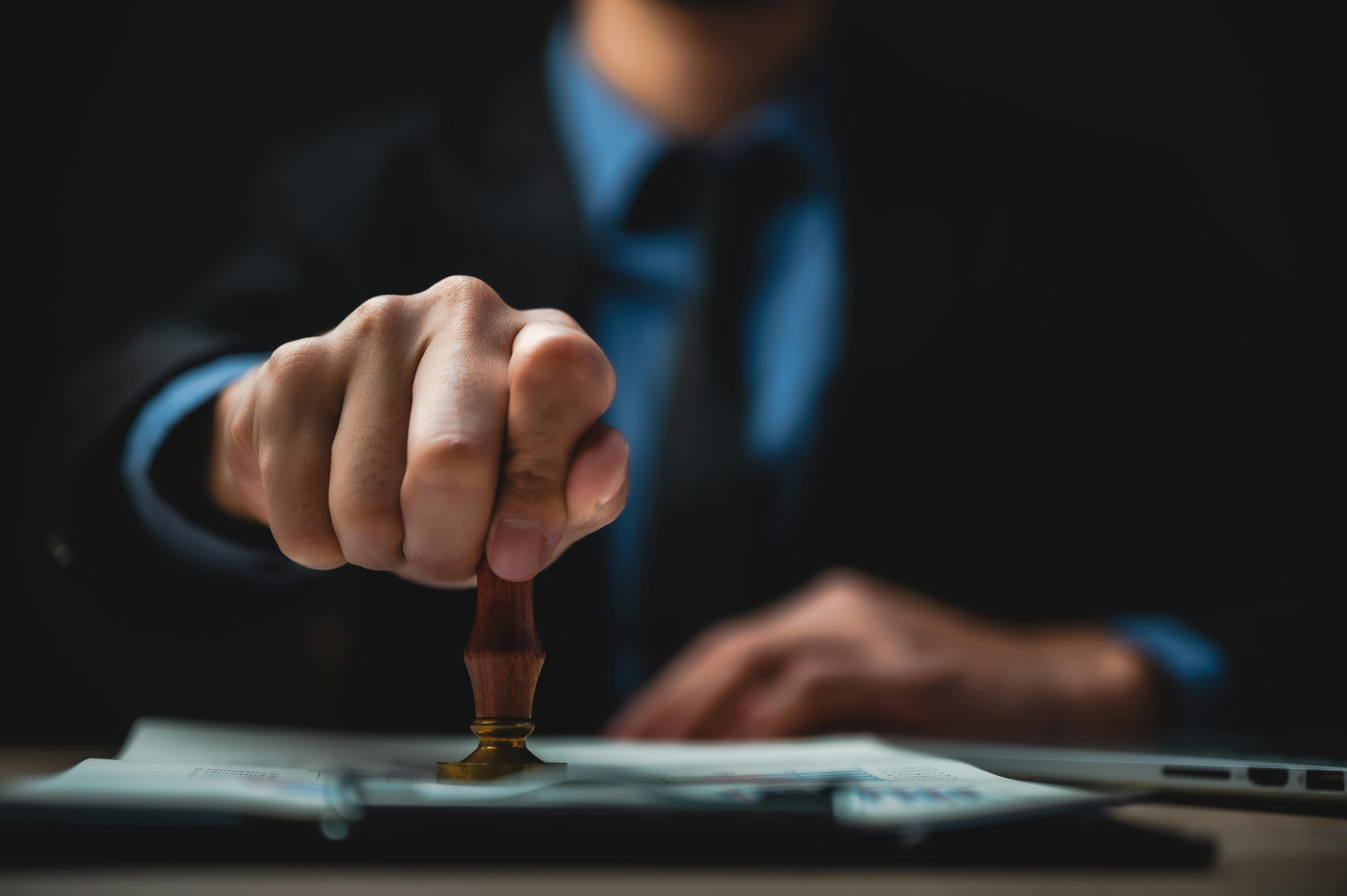 person timestamping a document
