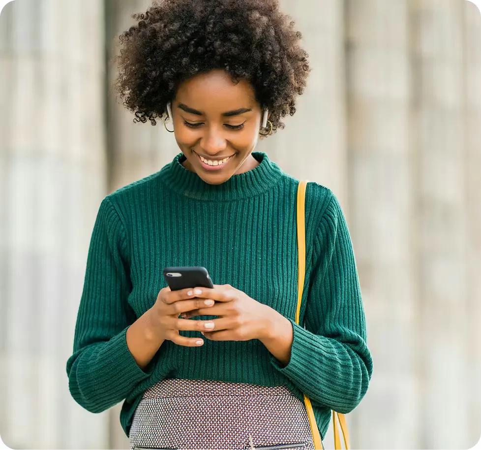 Customer using a mobile phone to pay bills with crypto through VBX