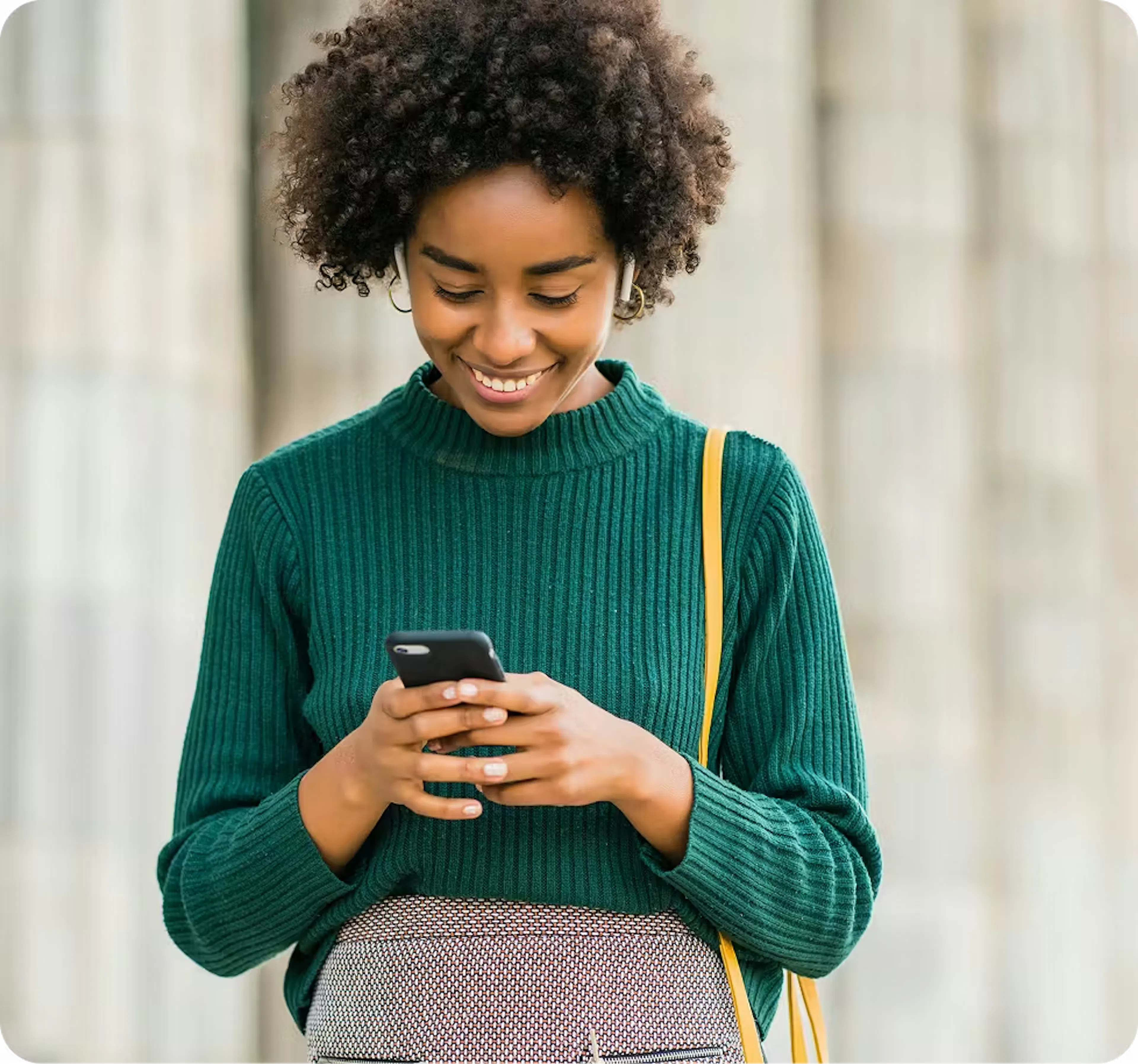 Customer using a mobile phone to pay bills with crypto through VBX