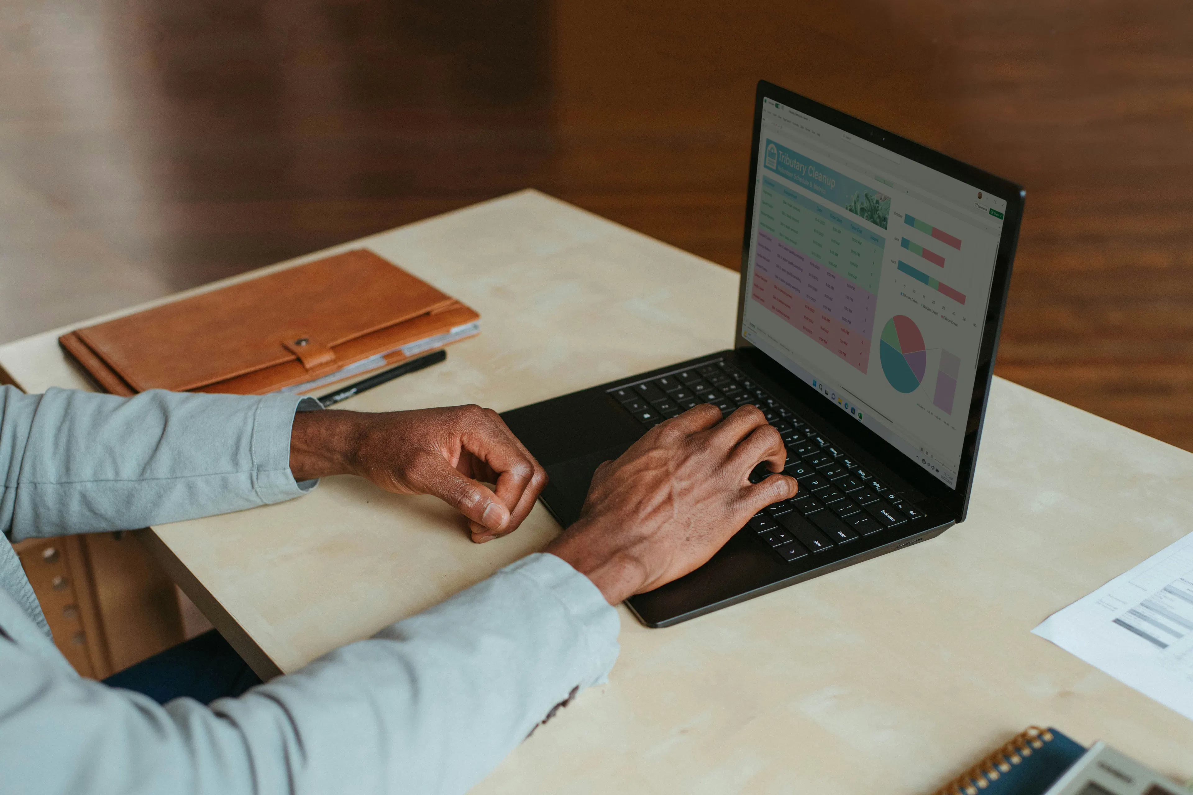 Person using a laptop to verify a Bitcoin transaction on a blockchain explorer