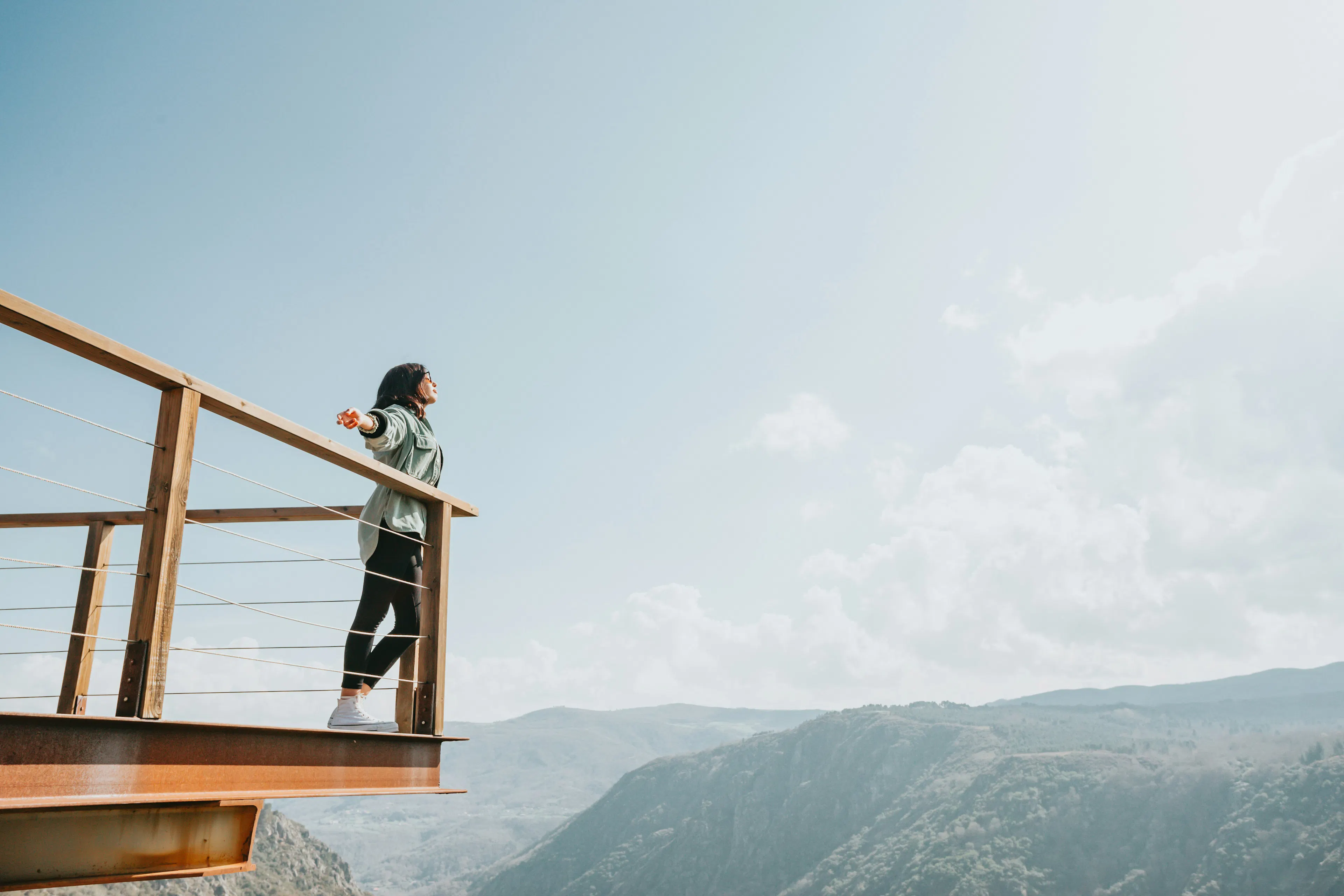 Woman overlooking the mountains symbolizing freedom and self-custody with VBX.