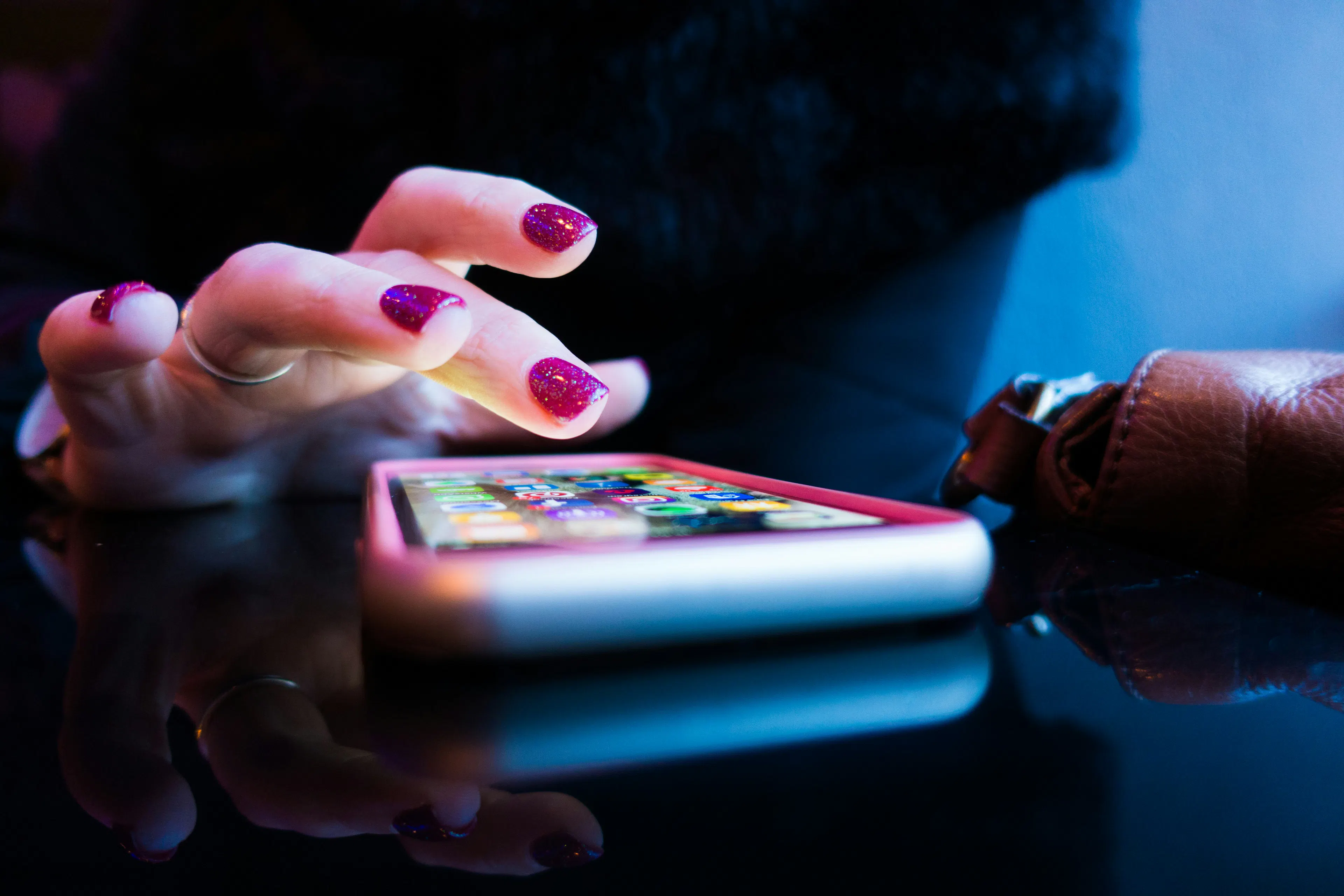 Relaxed young adult enjoying a simple crypto app on a phone, representing the casual, app-only user Shakepay suits best