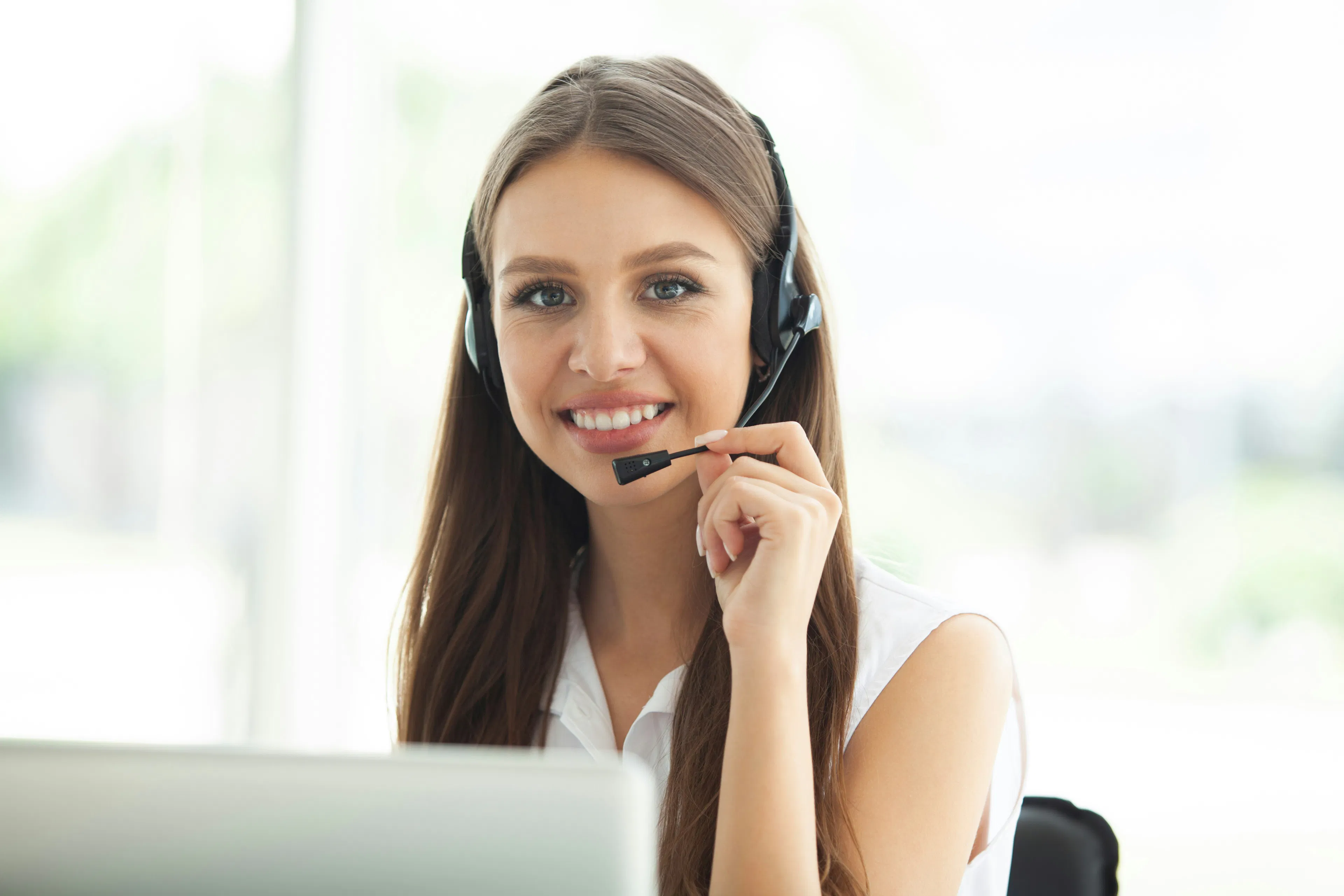 VBX support specialist helping a client by phone, representing full-service human support behind VBX's online, non-custodial platform