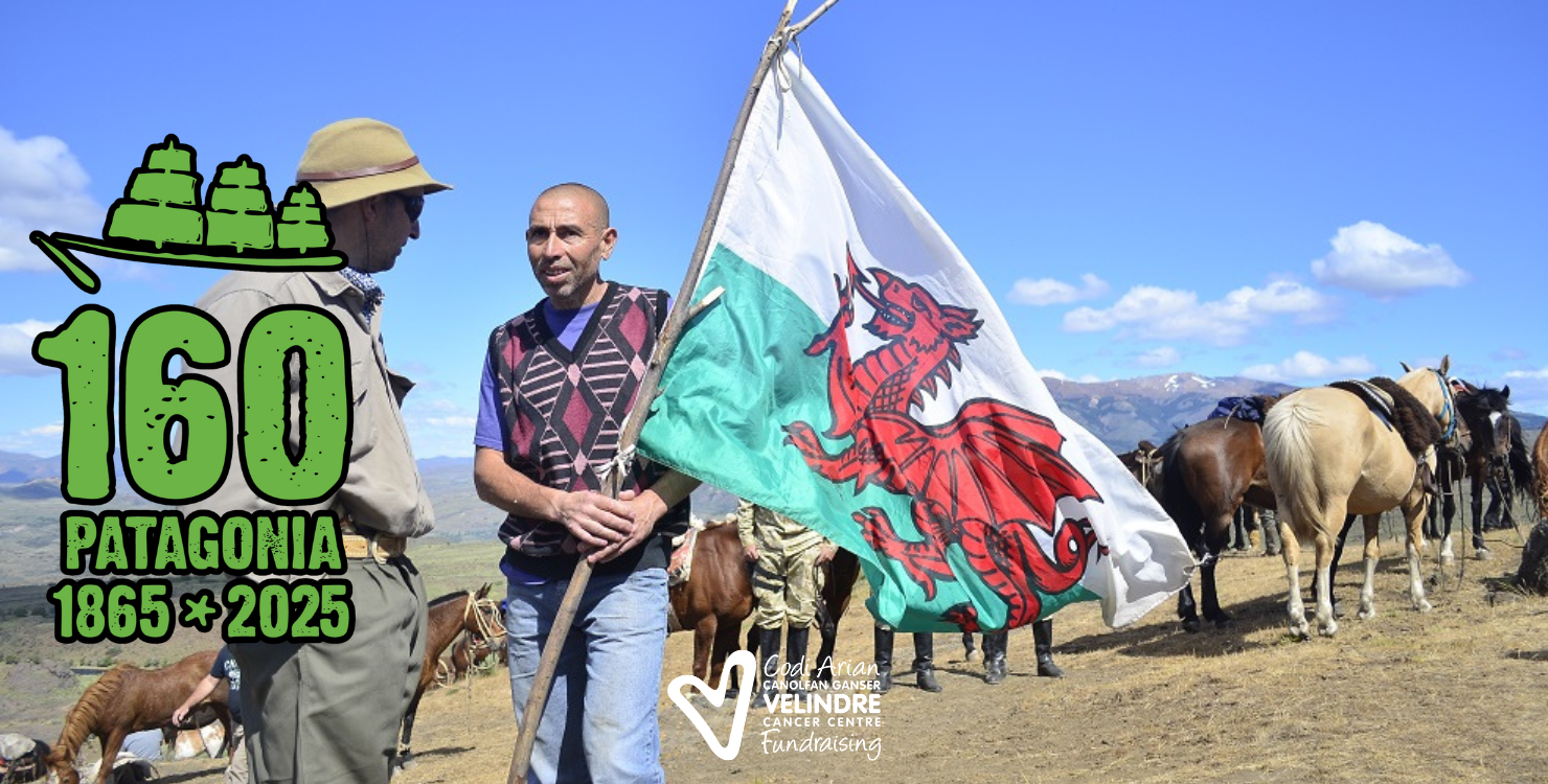 Banner for the Patagonia trek that reads 160, 1865 to 2025. Image of two smiling people with a Welsh flag atop the summit.