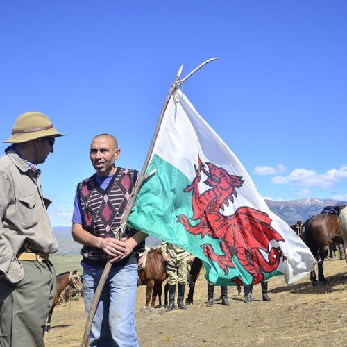 Trekkers holding the Welsh flag in Patagonia.