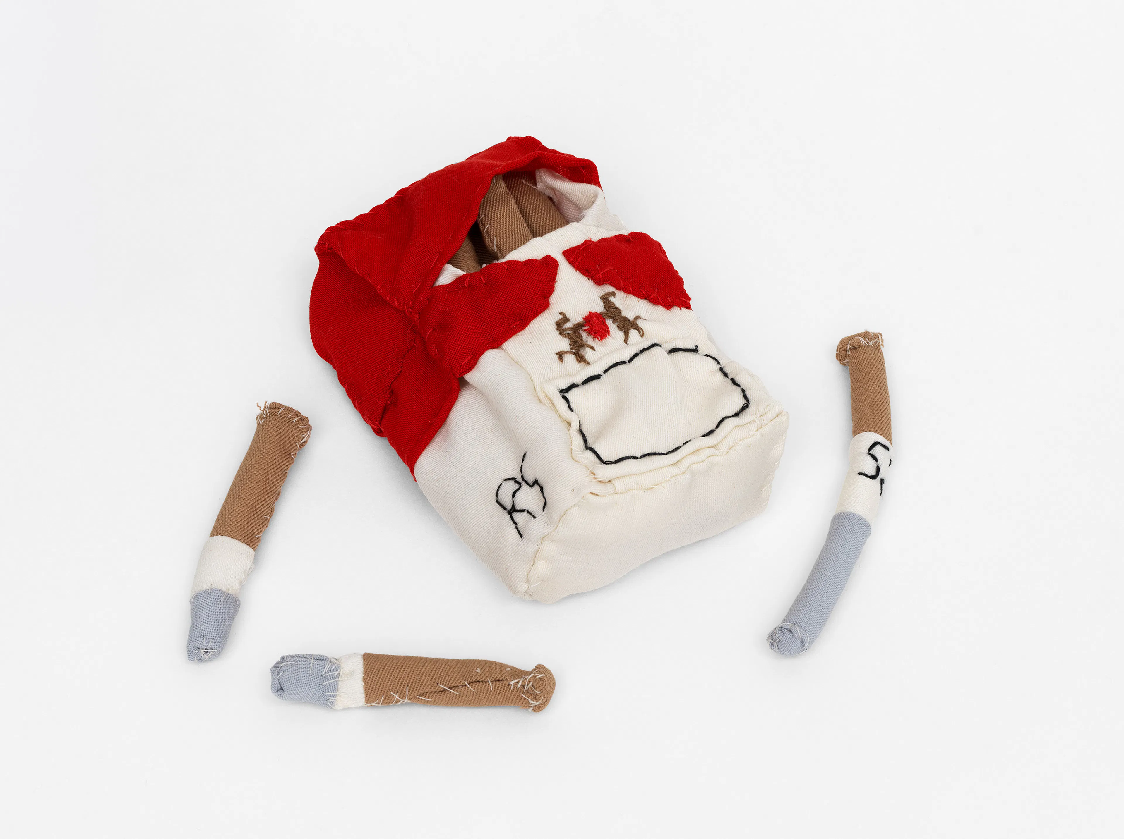 RAPHAELA SIMON Untitled (Cigarettes), 2026 Fabric, cotton wool Box: 1½ x 4¾ x 3¼ inches (4 x 12 x 8 cm); Cigarette 1: ½ x 2¾ x ¾ inches (1 x 7 x 2 cm); Cigarette 2: ¾ x 2½ x ¾ inches (2 x 6.5 x 2 cm); Cigarette 3: ¾ x 3½ x ¾ inches (2 x 9 x 2 cm) SIMS-44