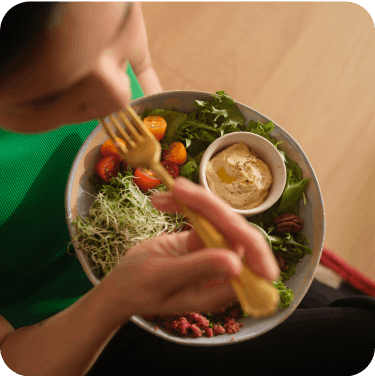 woman eating salad