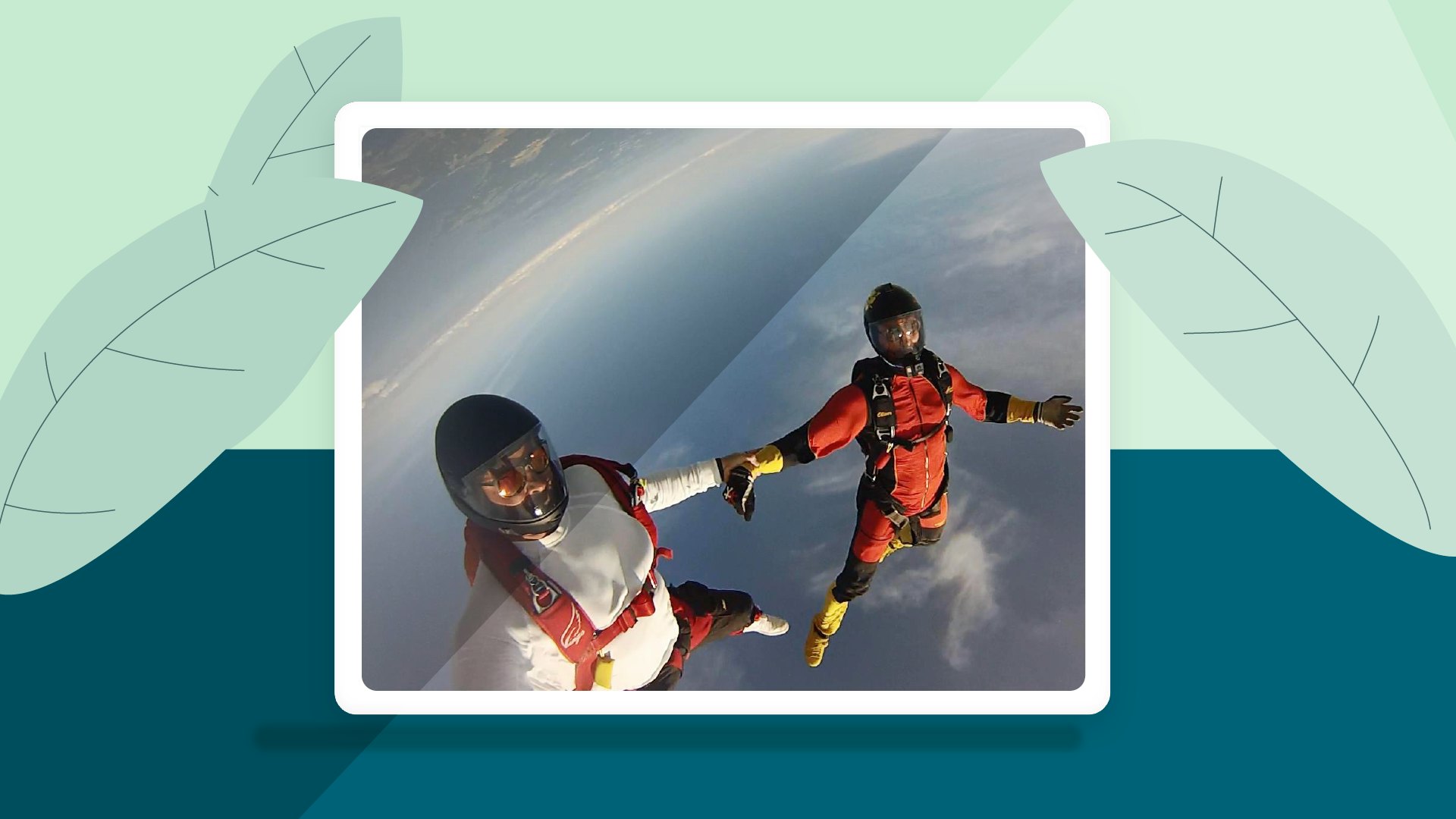 Two people skydiving holding hands.