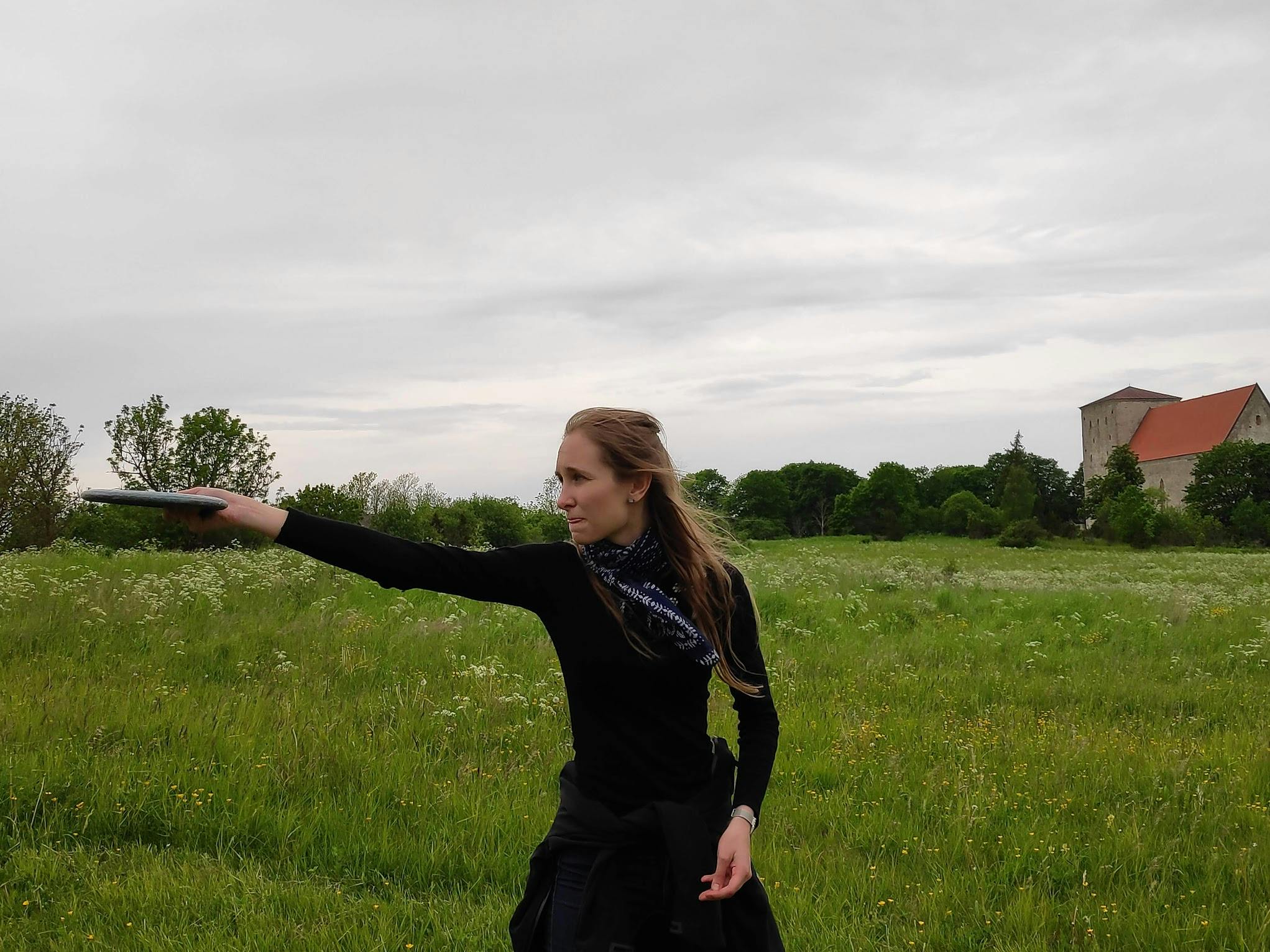 A woman standing in a field.
