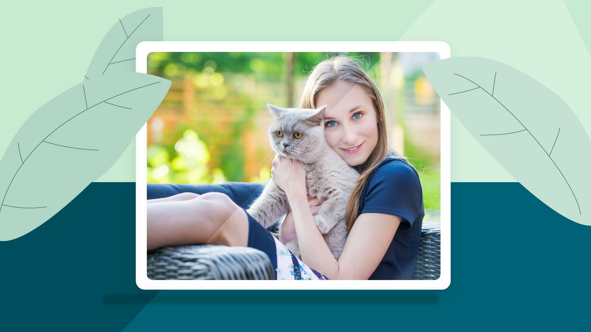 A young woman holding a cat.