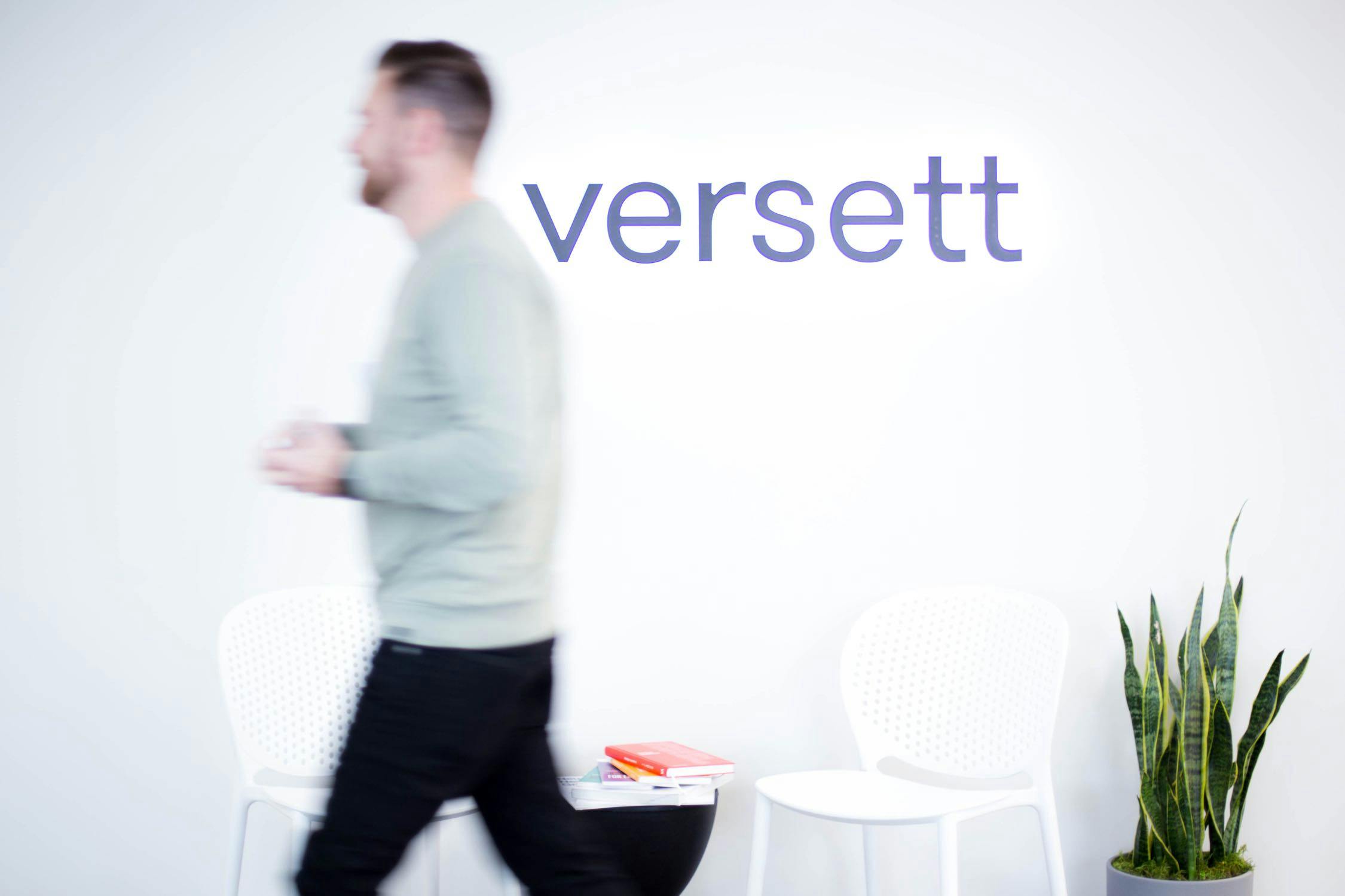 Terrance walking by the Versett sign