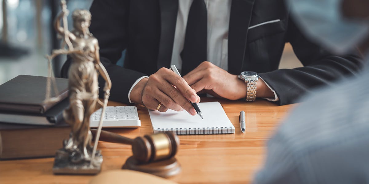 Photo of a Client with Attorney