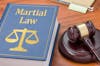 Judges Hammer With Martial Law Book