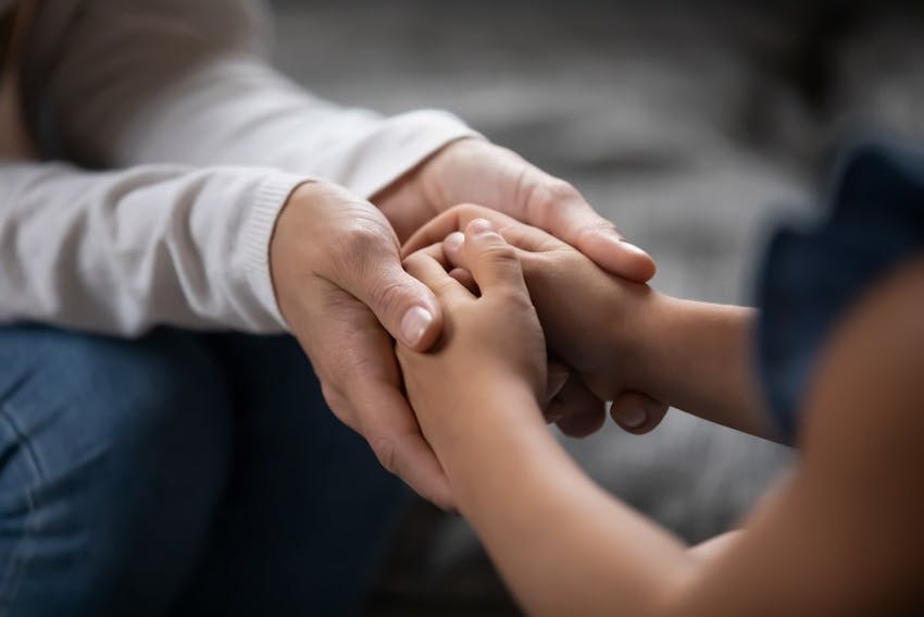 Two Persons Holding Hands