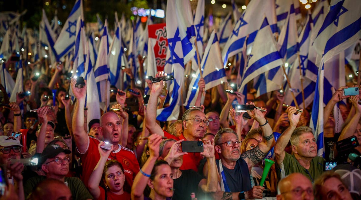 People attend a protest against the government's judicial overhaul plans in Tel Aviv
