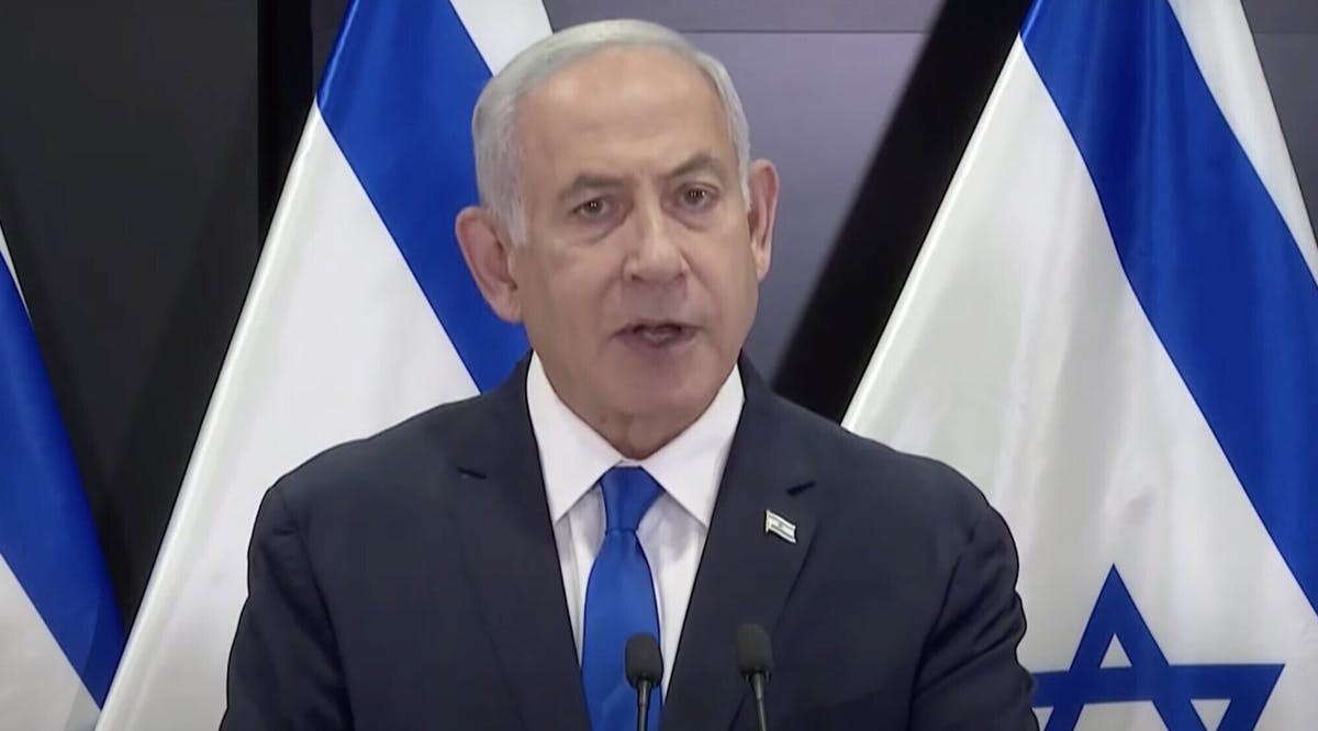 Prime Minister Benjamin Netanyahu gives a televised statement at military headquarters