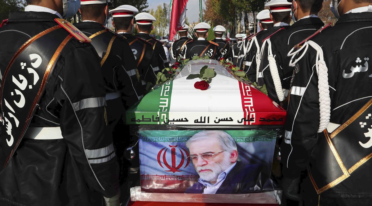 Military personnel stand near the flag-draped coffin of Mohsen Fakhrizadeh